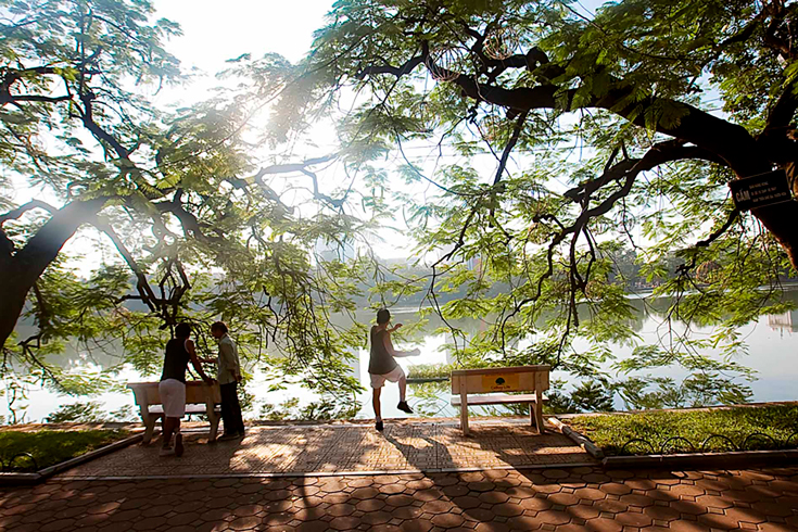 Doing morning exercise at Hoan Kiem Lake